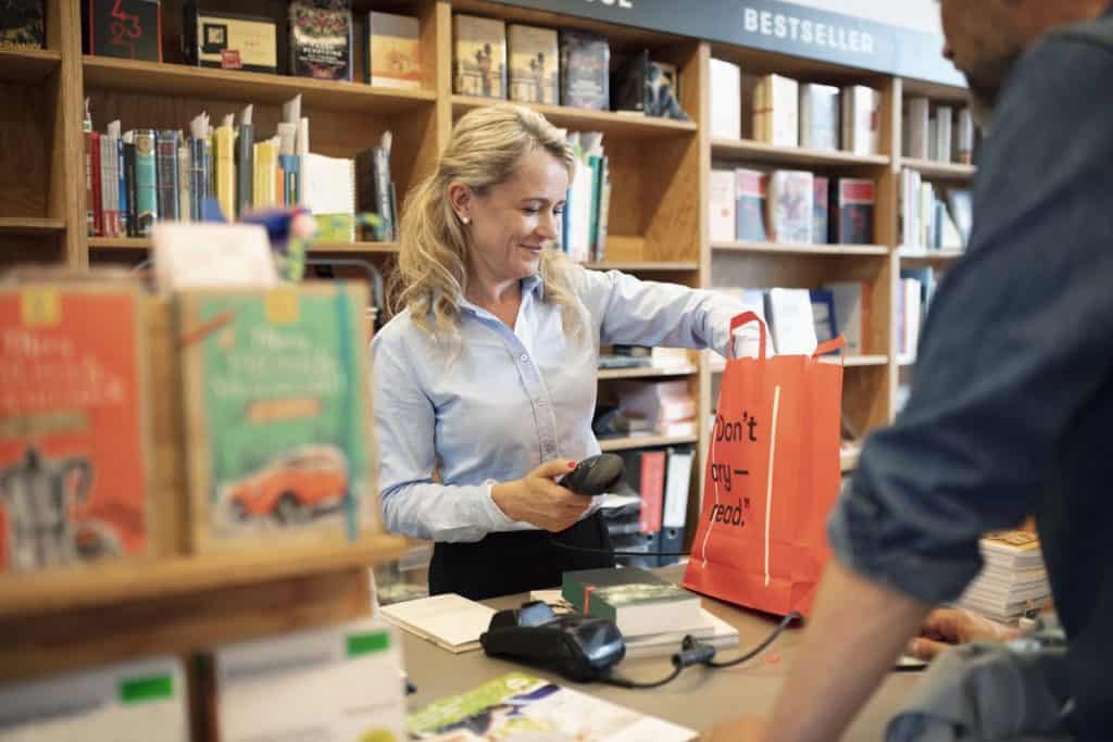 a person paying for a book